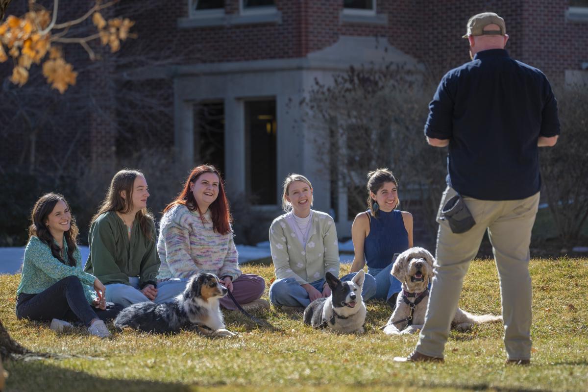 students outside with dogs